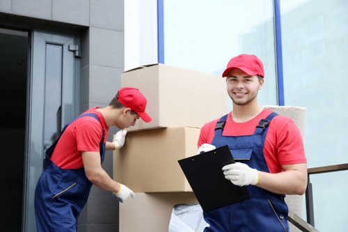 Workers handling items safely during a man and van move