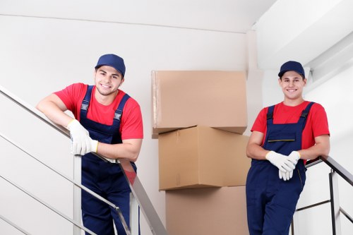 Furniture removal team handling a move in a Camden street