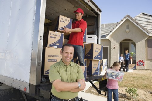 Business relocation items including desks, chairs, and IT equipment prepared for office removals