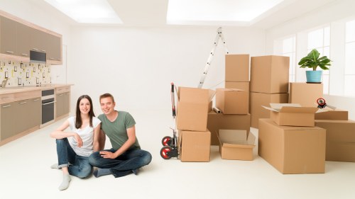 Professional movers handling furniture and boxes during a short notice Camden relocation