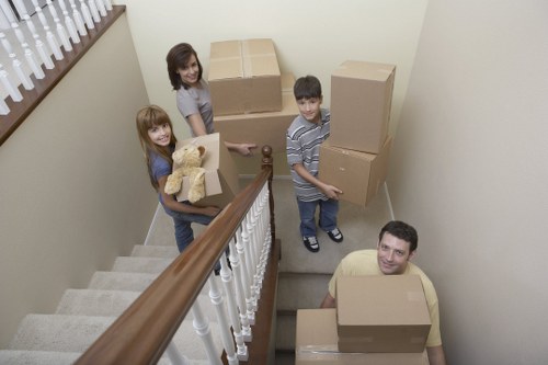 Careful packing and wrapping of household items for relocation